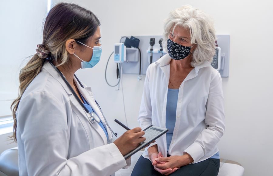 private health specialist woman talking to specialist
