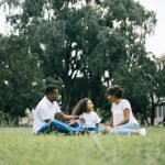 Family health insurance in the UK – mum, dad and two children speaking to private GP