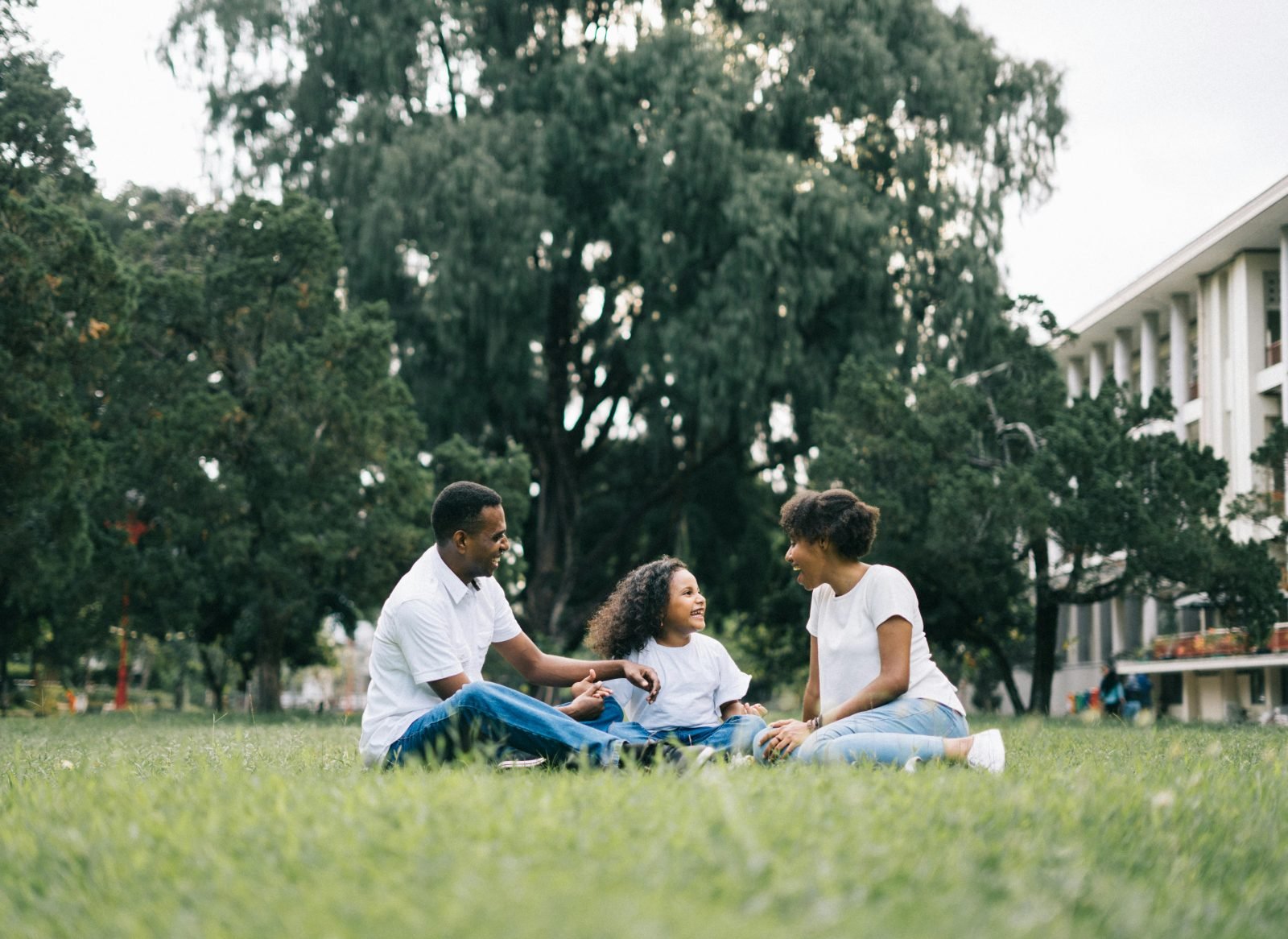 Family health insurance in the UK – mum, dad and two children speaking to private GP