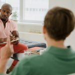 Woman working with a private health coach in a wellness clinic
