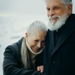 Senior couple reviewing health insurance documents