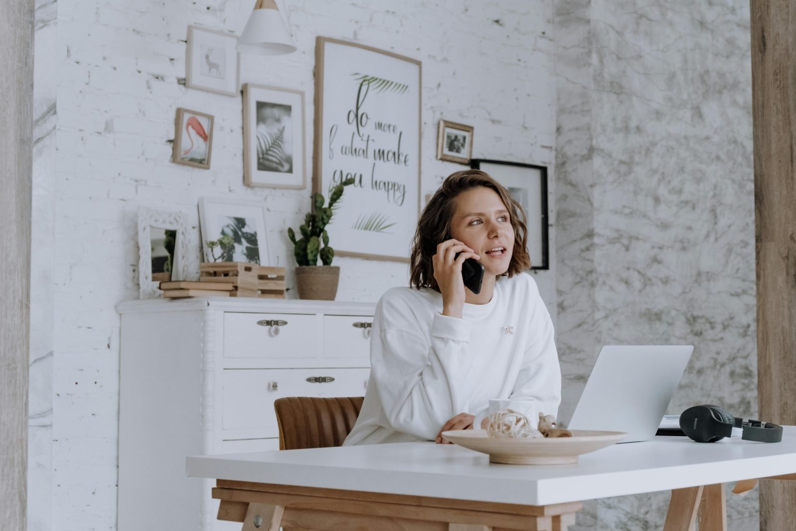 Self-employed person reviewing private health insurance documents in home office
